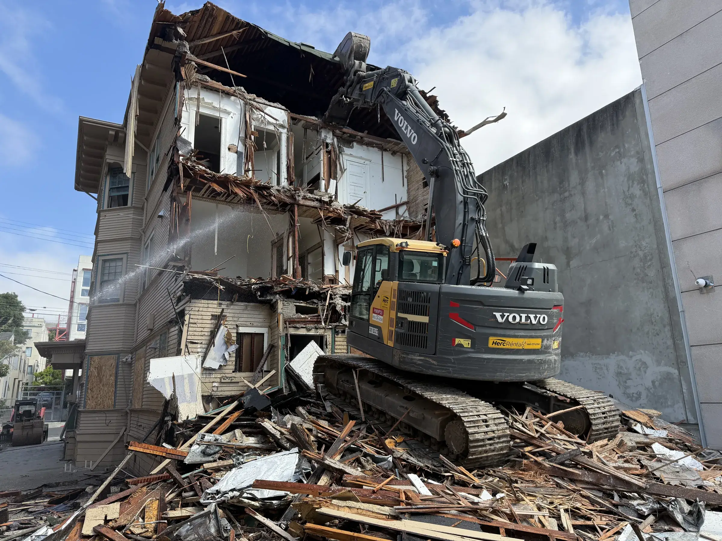 Demo Patrol excavator on a Sacramento demolition site