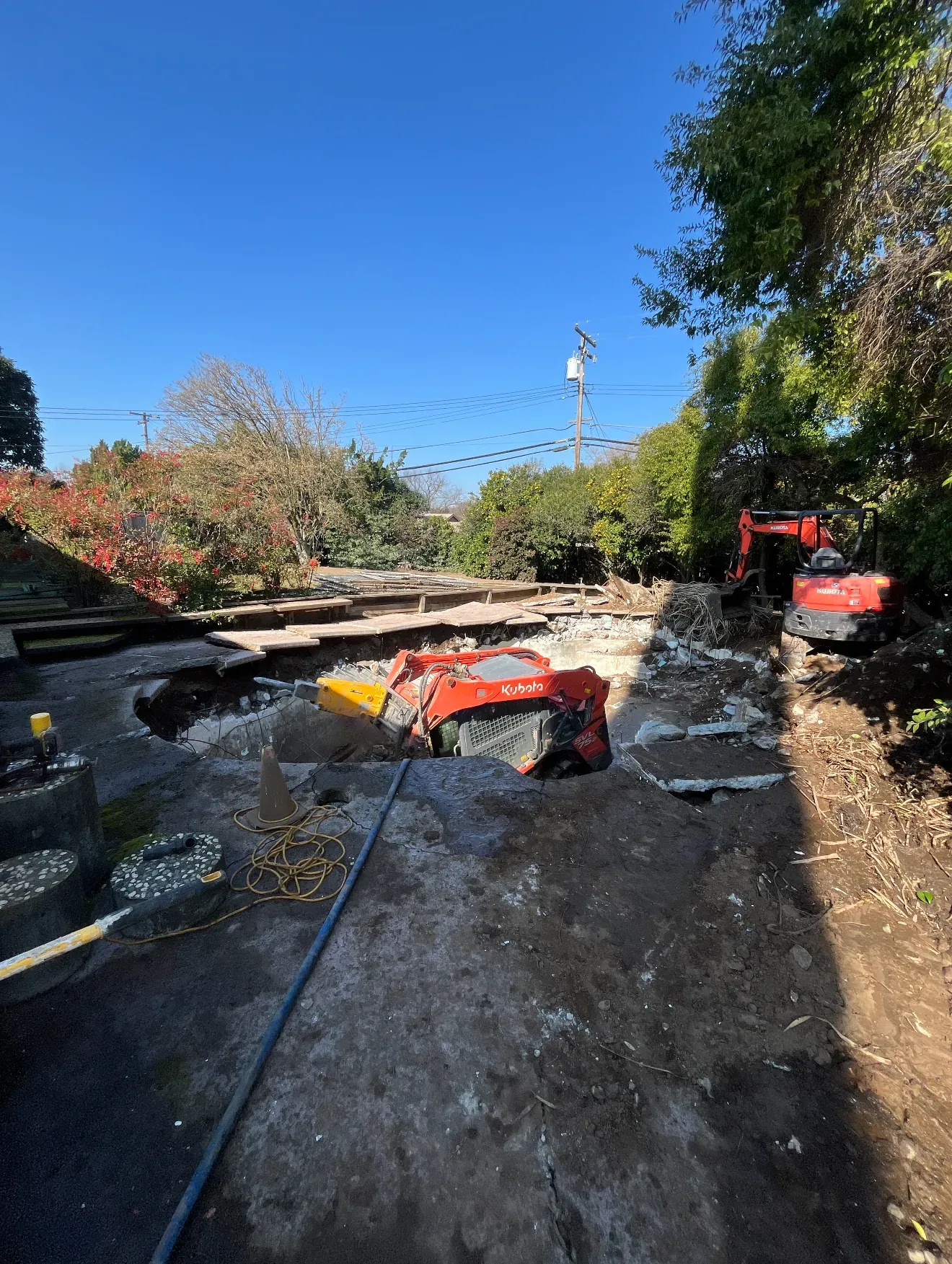 Pool demolition in progress on a Sacramento backyard